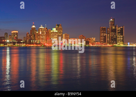 Skyline of Detroit Michigan USA seen from the city of Windsor Ontario Canada at dusk Stock Photo