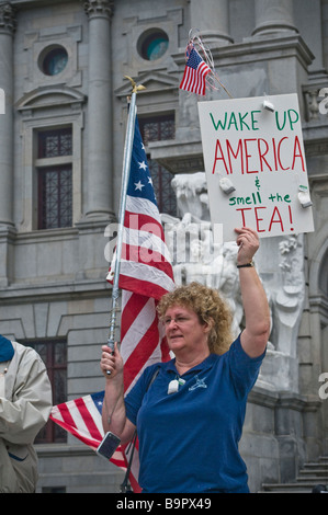 anti spending tax protest tea party Harrisburg PA , demonstrator, wake up America smell the tea USA flags Stock Photo