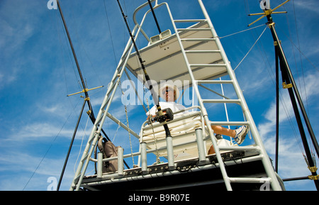 Big game fishing, fishermen on flybridge of fishing boat Saint Gilles La Réunion France | Fischer auf der Brücke, Angelboot Stock Photo