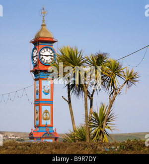 A view of the iconic Jubilee clock and trees long the seafront at Weymouth, Dorset. UK. Stock Photo