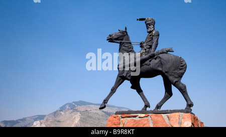 Bronze statue over grave of western character Jeremiah Liver Eating Johnson Old Trail Town Cody Wyoming USA Stock Photo