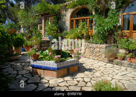 Spanish courtyard garden with formal pond and water feature, Jesus