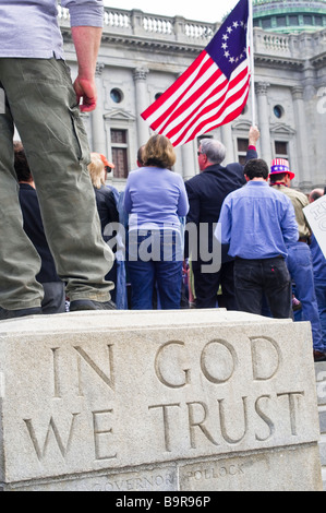 anti spending tax protest tea party Harrisburg PA , demonstrator, In God We Trust, USA american flag Stock Photo