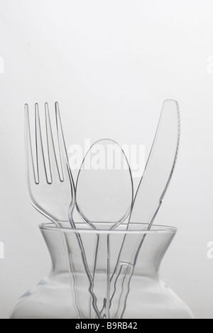 Plastic cutlery in a glass pot Stock Photo