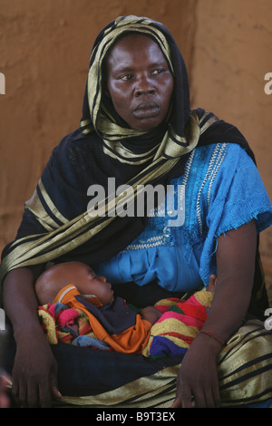 A Woman and her baby pictured in a Refugee Camp near Goz Beida, Chad, Africa Stock Photo