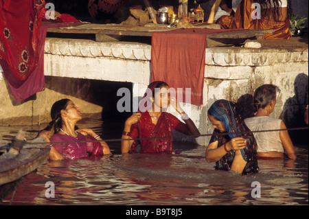 ladies bathing in the Ganges at Varanasi, Uttar Pradesh india Stock Photo