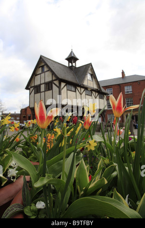 The Old Grammar School in Market Harborough with spring hulbs in the foregound Stock Photo