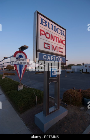 Sign at the entrance to a Closed Buick Pontiac GMC Dealership in San Jose, CA. Stock Photo