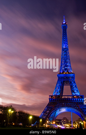 View of the Eiffel tower illuminated in blue displaying the European symbol due to the French presidency of the European Union Stock Photo