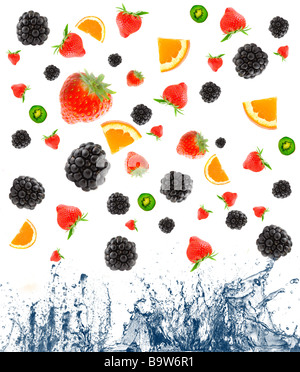 berry and fruit falling in juice Isolation Stock Photo