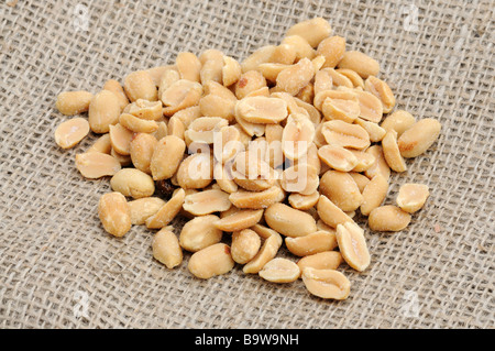 Salted peanuts on burlap Stock Photo