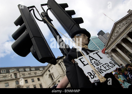 G20 demonstration London mock hanging of a banker from traffic light with eat the bankers sign Stock Photo