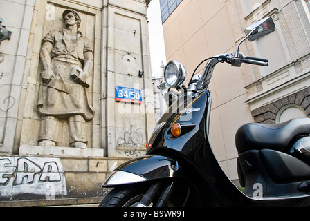 Motorcycle in front of an old communist building in the streets of Warsaw, Poland, Europe. Stock Photo