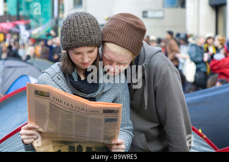 G20 summit protesters reading Financial Times Bishopsgate - City of London UK Stock Photo