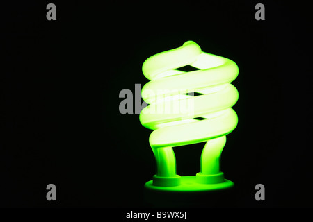 Energy saving lightbulb lighting up Stock Photo