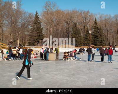 Family skating on a frozen lake Stock Photo
