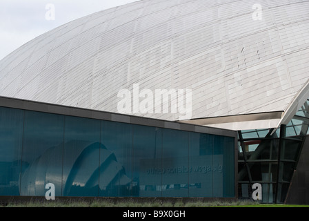 the SECC reflected in the  windows of the Science centre Stock Photo