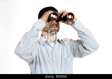 Man looking through binoculars isolated on white Stock Photo
