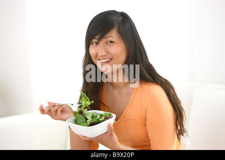 Woman eating salad Stock Photo