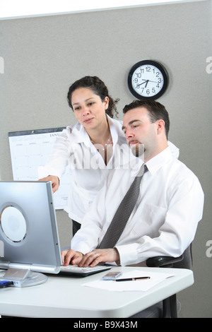 Two businesspeople look at computer Stock Photo