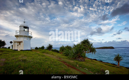 Fingal lighthouse on grassy hill overlooking blue pacific ocean Stock Photo