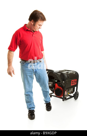 Man pulling a portable electric generator behind him Full body isolated  Stock Photo