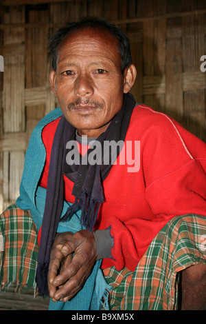 portrait of a mishing tribe man in traditional dress