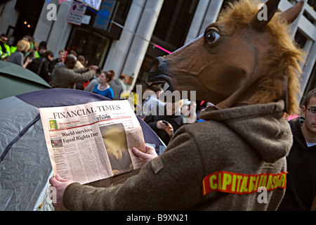 Climate change / g20 protestor in costume reading a doctored copy of the Financial Times Stock Photo