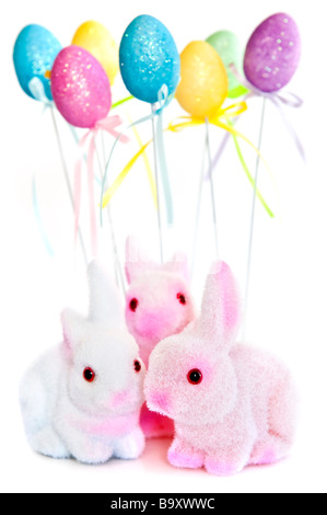 Cute Easter bunny toys and balloons isolated on white background Stock Photo