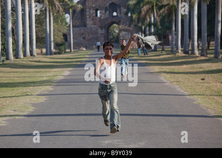 Young Indian Men Running inside Purana Qila Fort in Delhi India Stock Photo