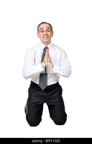 Business man praying in suit isolated on white background Stock Photo