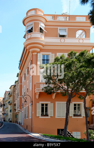 A street scene in Monte Carlo Monaco showing a row of brightly coloured apartments Stock Photo