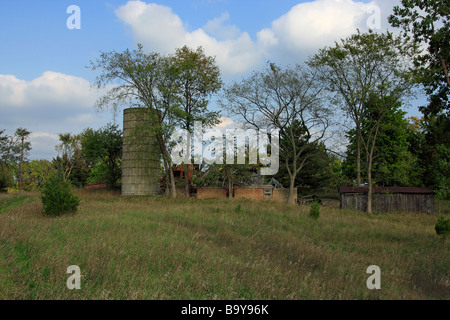 American rural landscape with the historical tile grain silo in Michigan USA US farming close up low angle from below horizontal background hi-res Stock Photo