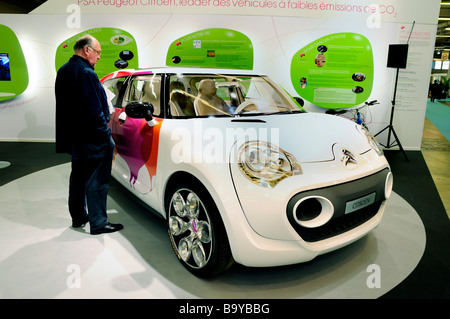 Paris France, Display, Car Shopping, 'PSA Peugeot Citroen' Car Company, Man Looking 'Sustainable Trade Show', Electric Cars for sale green cars market Stock Photo