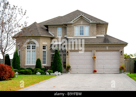 New detached single family luxury home with brick facade Stock Photo
