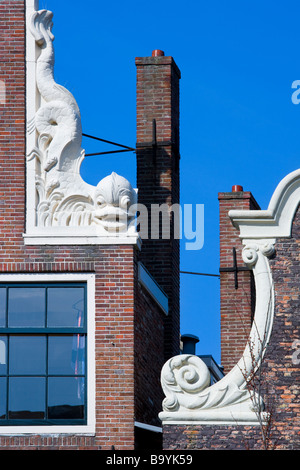 Amsterdam late 17th Century Canal House Gable Roof Top with Dolphin Ornament Brouwersgracht 48 Stock Photo