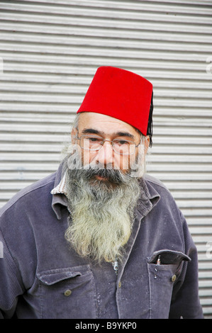 bearded man with red Turkish hat Stock 