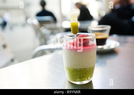 Almond mousse with pistachio coulis and berries Stock Photo