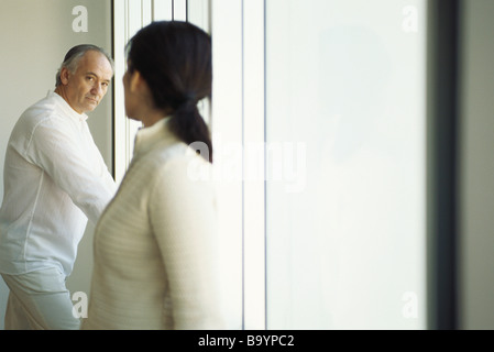 Mature couple looking at one another Stock Photo