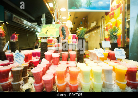 Stacked drinks display at fresh fruit juice shop Stock Photo