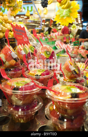 Stacked containers of sliced mixed fresh fruit Stock Photo