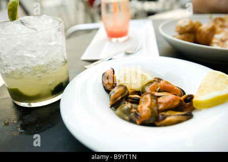 Steamed mussels and mojito Stock Photo