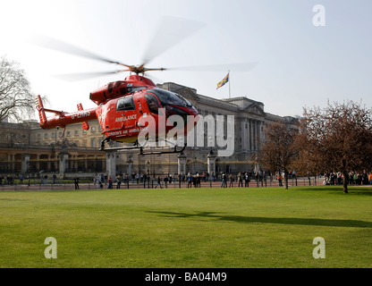 London's Air Ambulance HEMS takes off in front of Buckingham Palace after responding to an emergency Stock Photo