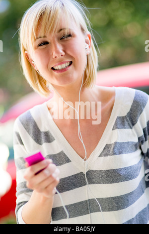 Girl listening to 'iPod' Stock Photo