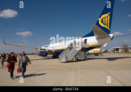 Passengers disembarking from Ryanair Boeing 737 800 airplane Nimes France Europe Stock Photo