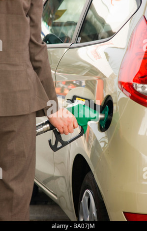Lady Filling Up Car With Fuel at Modern Gas Station Stock Photo - Alamy