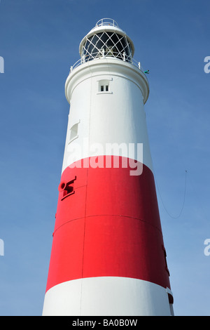 PORTLAND BILL, DORSET, UK - MARCH 15, 2009:  Lighthouse painted in traditional Red and white bands against blue sky Stock Photo