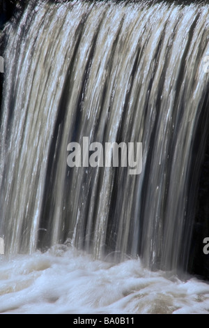A waterfall from a reservoir to a canal Stock Photo