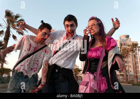 Young people dressed in horror costumes for Purim celebrations, Tel Aviv, Israel Stock Photo