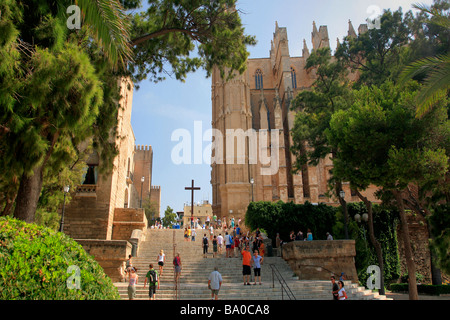 Tourists walking up the steps to Palma Cathedral Palma City Mallorca Majorca Island Balearic Isles Mediterranean Sea Spain Stock Photo